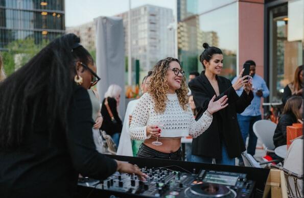 People dancing in the rooftop bar at The Stratford hotel