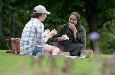 Women sitting in the Park and eating a picnic