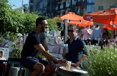 Two men in Barge East's garden