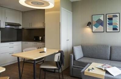 A kitchen and living area