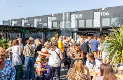 a group of people stand on the terrace of Snoozebox