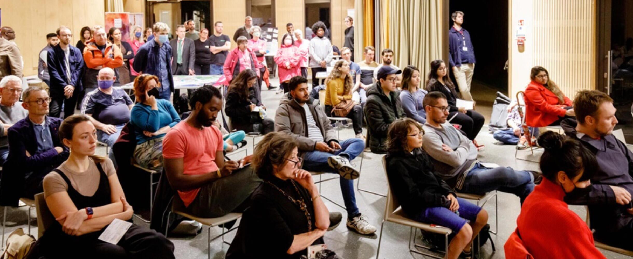 The audience at Your Neighbourhood Talks listen to a speaker