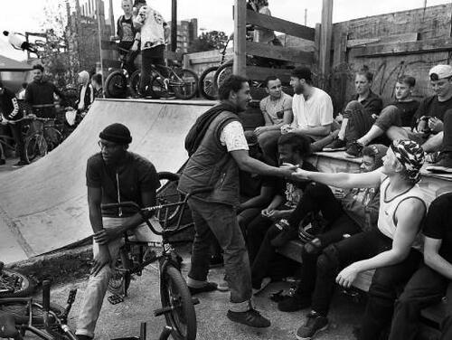 Black and white photo of people at a skate park in Hackney Wick