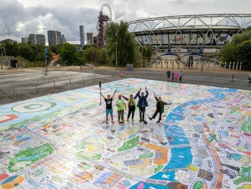 Photo of staff with the finished Angry Dan mural for London Mural Week by London Stadium