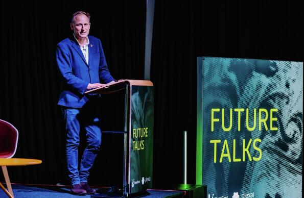 A speaker at a lectern 