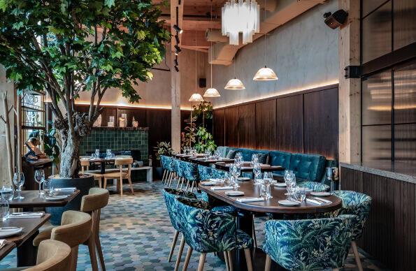 Chic blue dining chairs inside Bread Street Kitchen