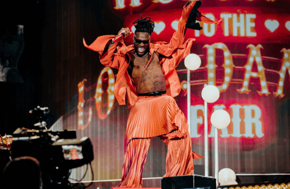 Burna Boy dances whilst on stage 