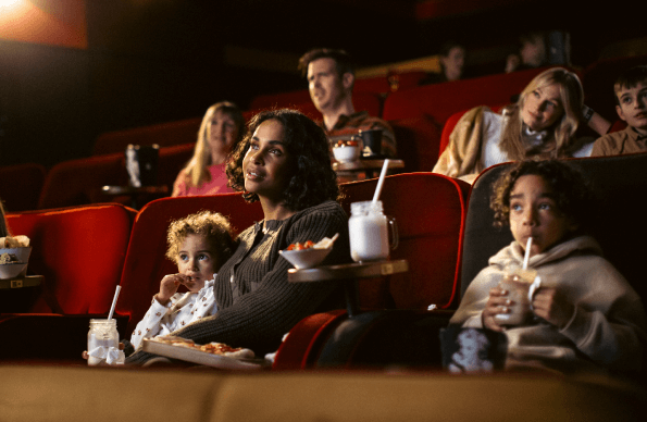 A family watch a cinema film at Everyman Cinema