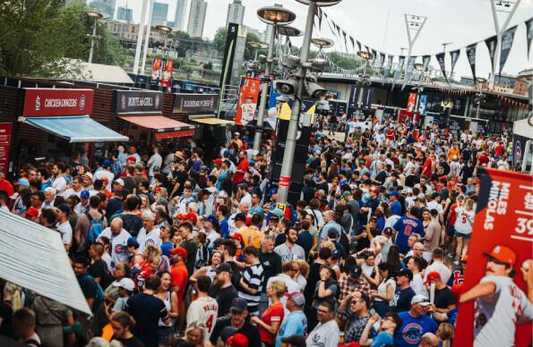 A crowd outside London Stadium enjoying the different food and drink options