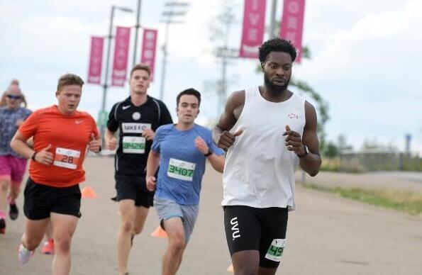 People running at Queen Elizabeth Olympic Park