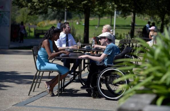 People enjoying food outside Timber Lodge