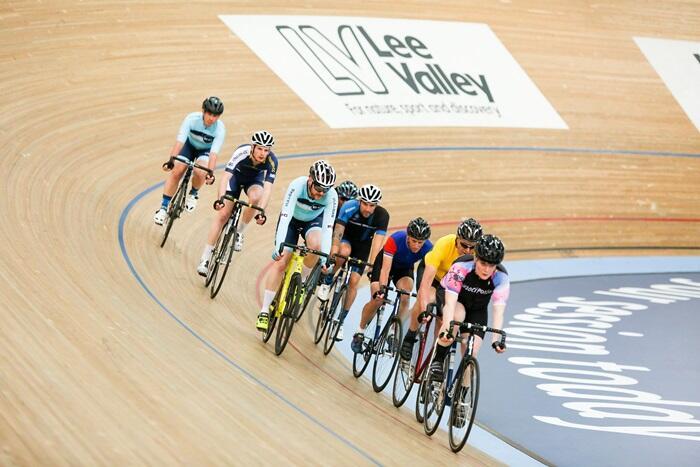 Cyclists riding in velodrome